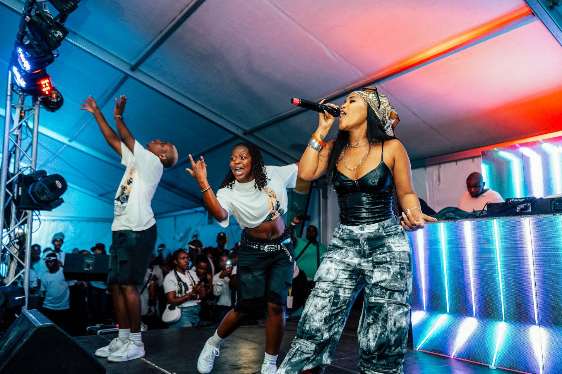 Artist and dancers performing on stage