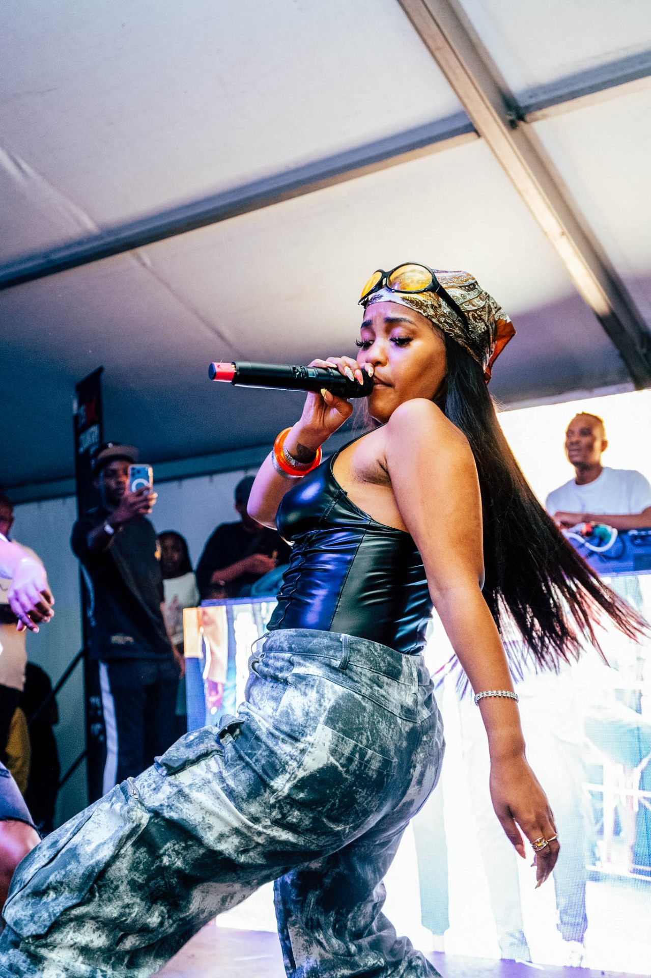 Singer mid-performance with hair flowing